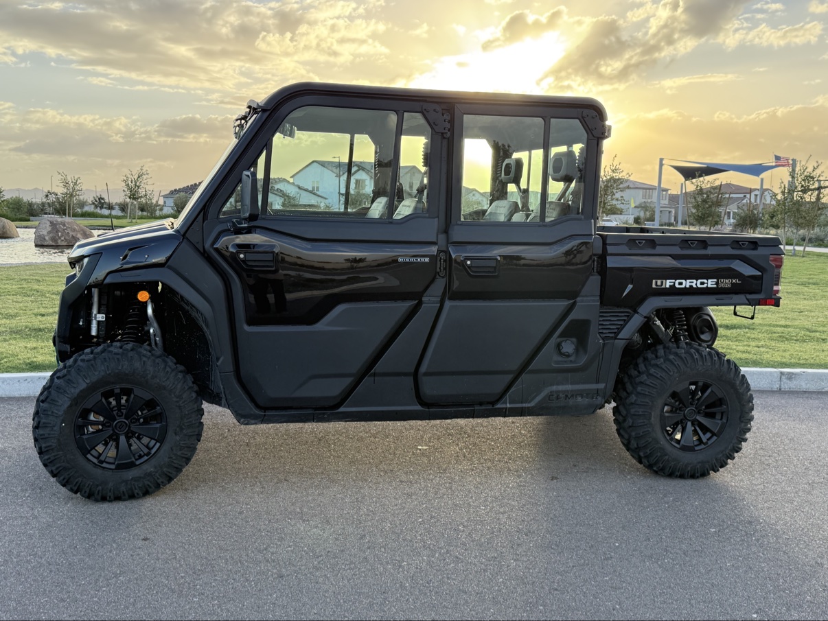 Side profile of the machine glowing in golden-hour light at sunset